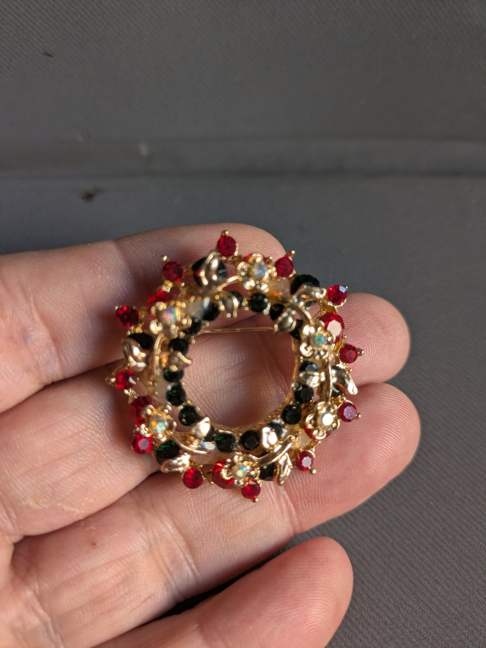 Gold-Tone Wreath Brooch with Red and Black Crystal Accents
